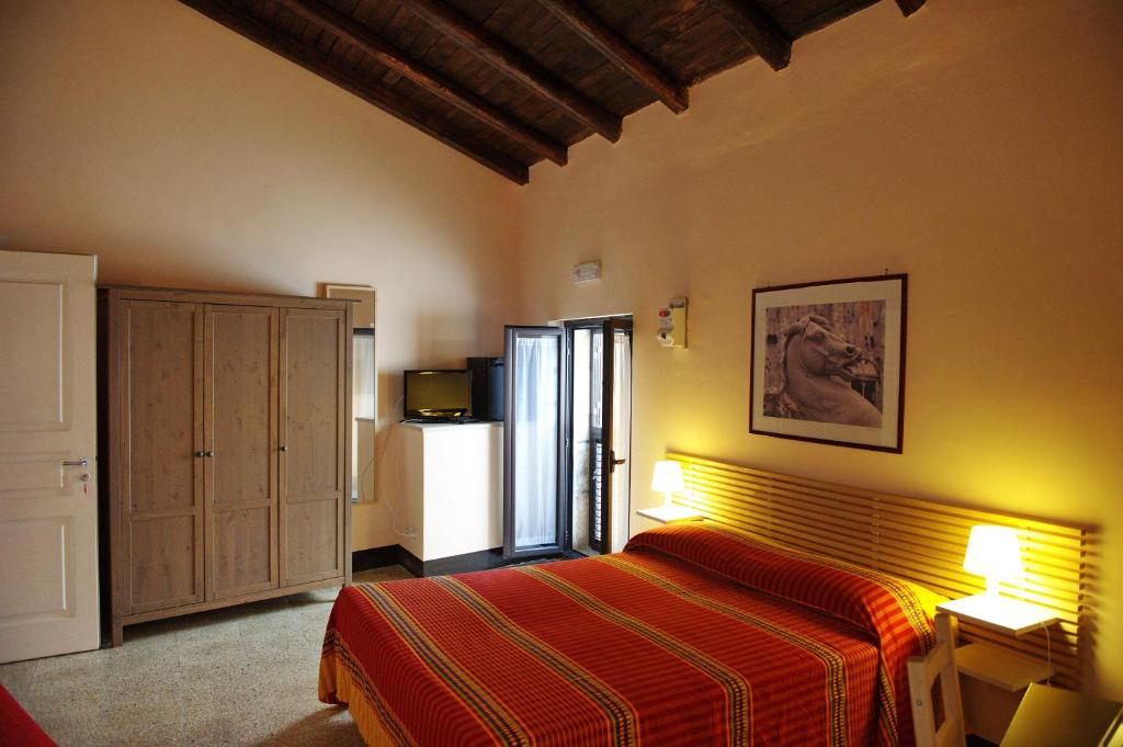 A bed or beds in a room at B&B Porta della Terra