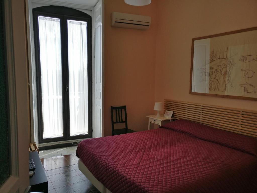 A bed or beds in a room at B&B Porta della Terra