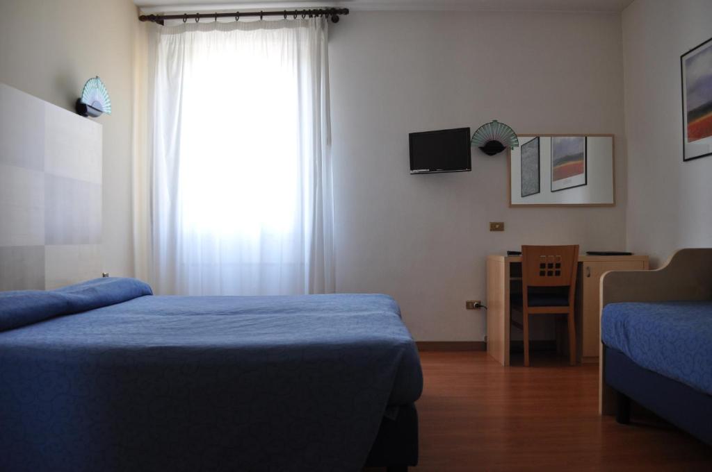 Postel nebo postele na pokoji v ubytování Hotel Igea