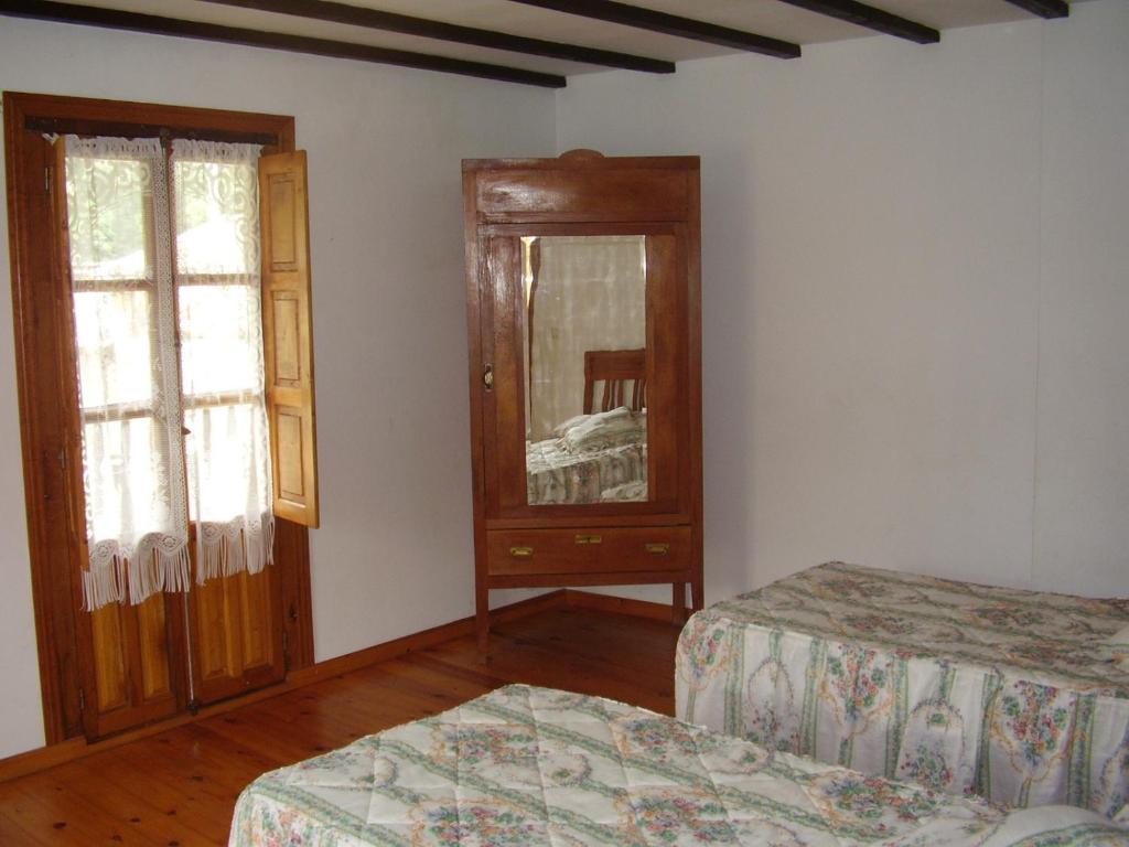 Postel nebo postele na pokoji v ubytování Viviendas Rurales Traldega