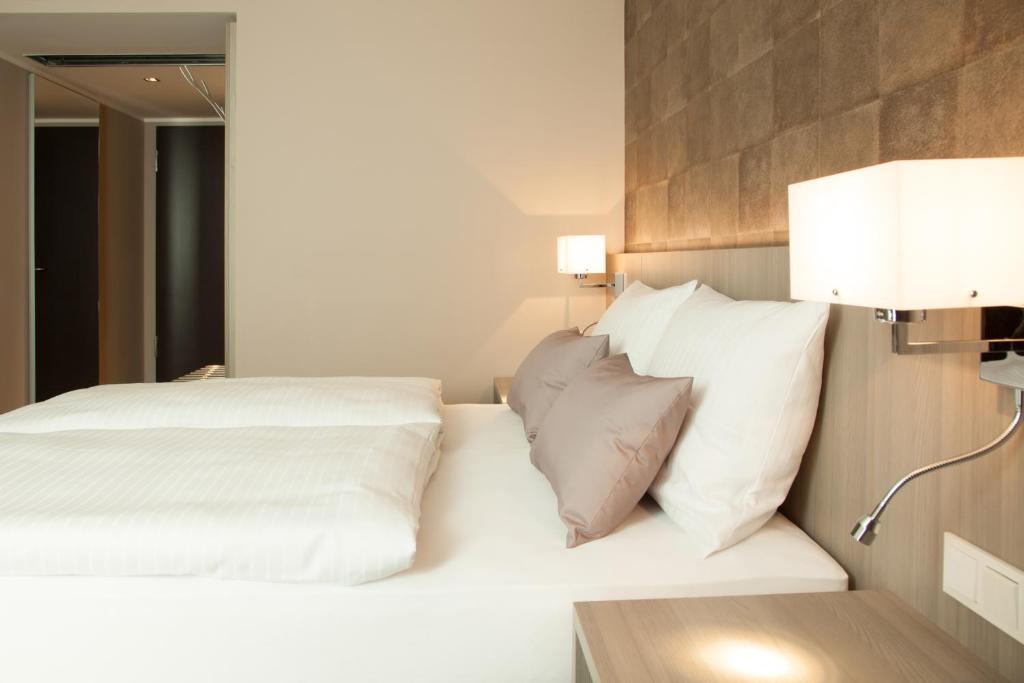 Postel nebo postele na pokoji v ubytování relexa hotel München