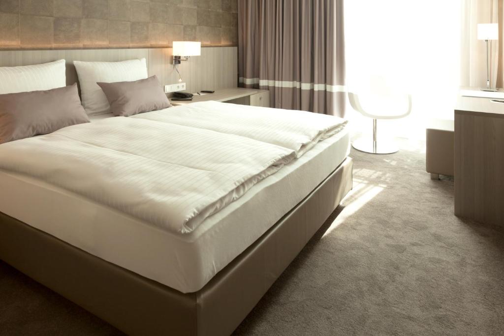 Postel nebo postele na pokoji v ubytování relexa hotel München