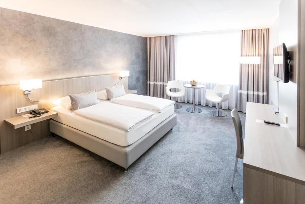 Postel nebo postele na pokoji v ubytování relexa hotel München