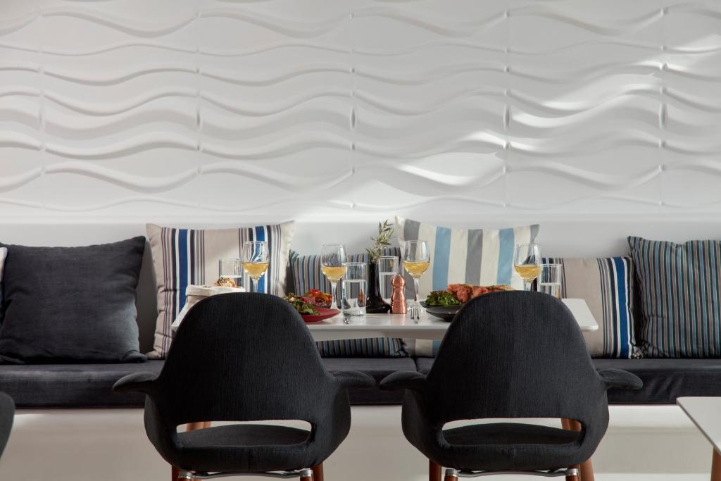 A seating area at Absolute Mykonos Suites & More