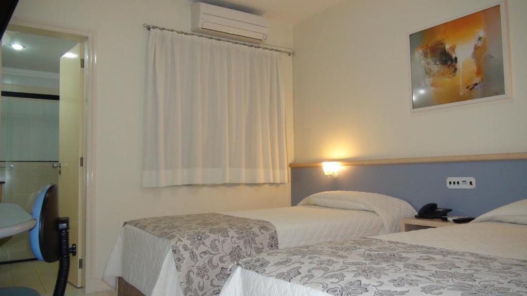 Postel nebo postele na pokoji v ubytování Asppen Hotel