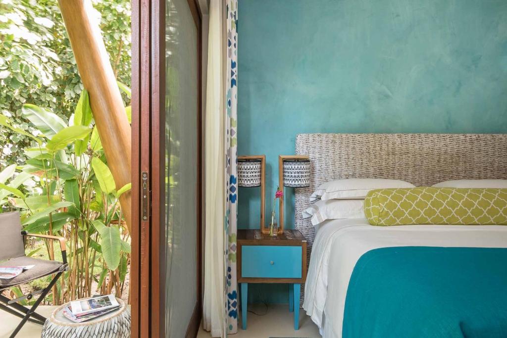 Postel nebo postele na pokoji v ubytování Campo Bahia Hotel Villas Spa