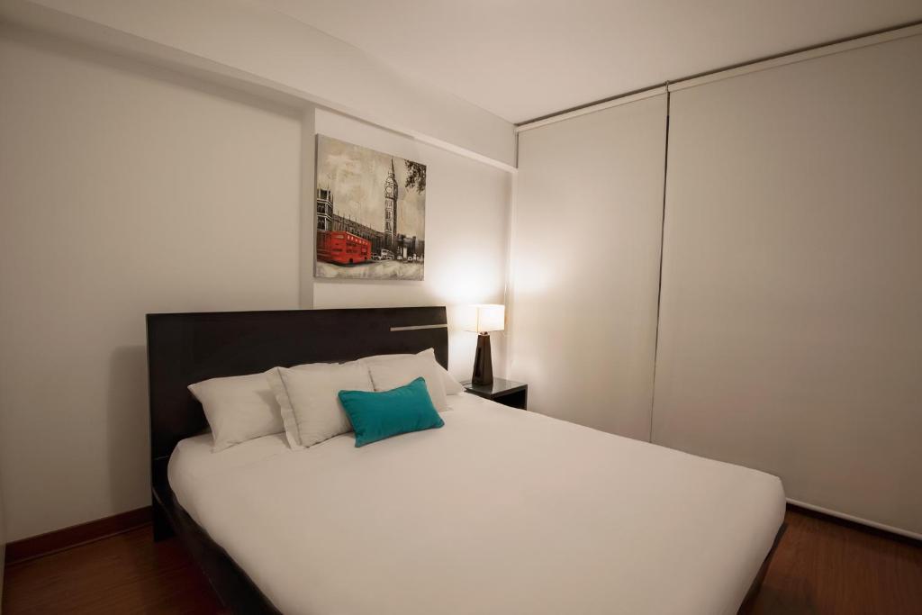 Llit o llits en una habitació de Mariel Hotel Boutique