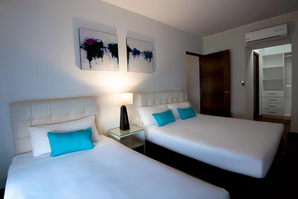 Llit o llits en una habitació de Mariel Hotel Boutique