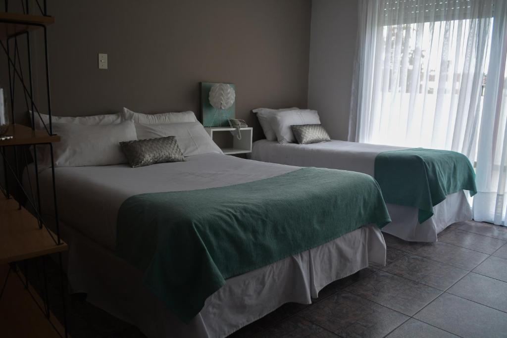 Postel nebo postele na pokoji v ubytování Argenta Apart Hotel