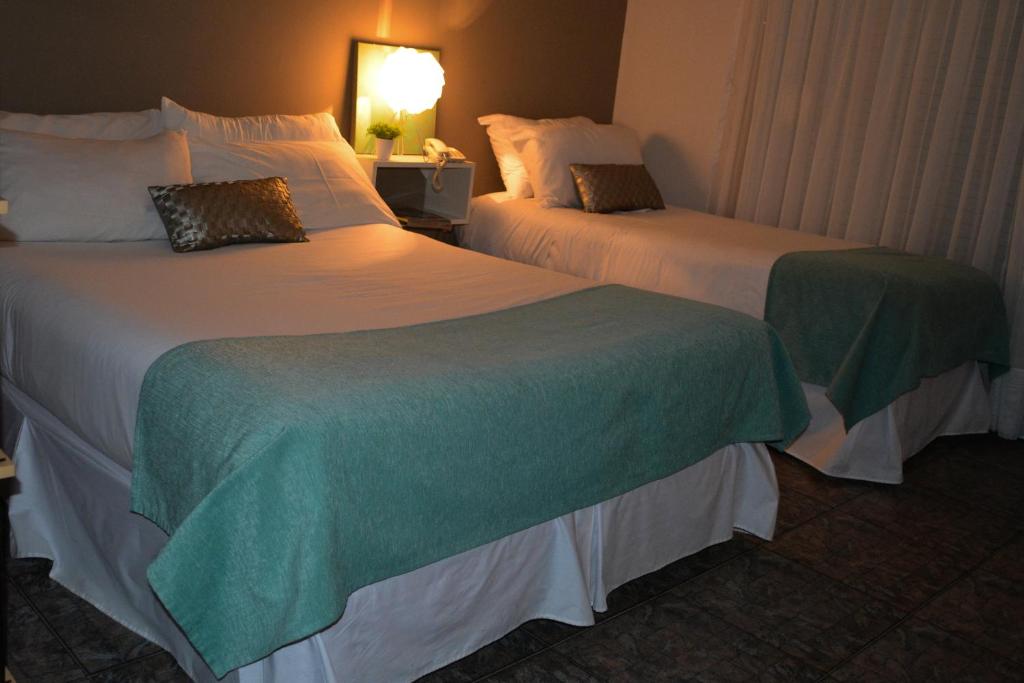 Postel nebo postele na pokoji v ubytování Argenta Apart Hotel