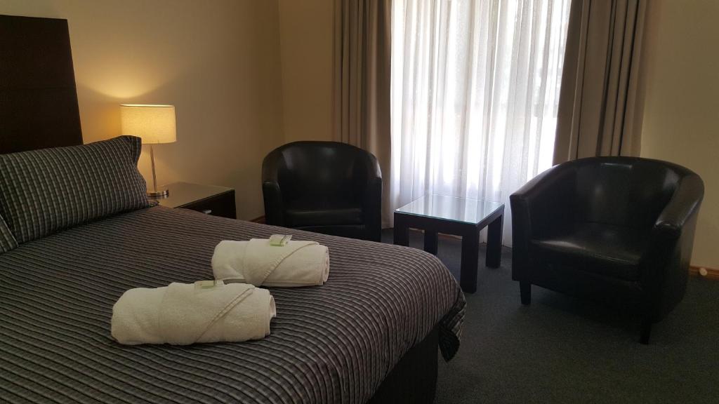 Postel nebo postele na pokoji v ubytování Gateway Motor Inn
