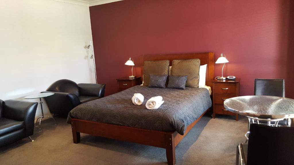 Postel nebo postele na pokoji v ubytování Gateway Motor Inn
