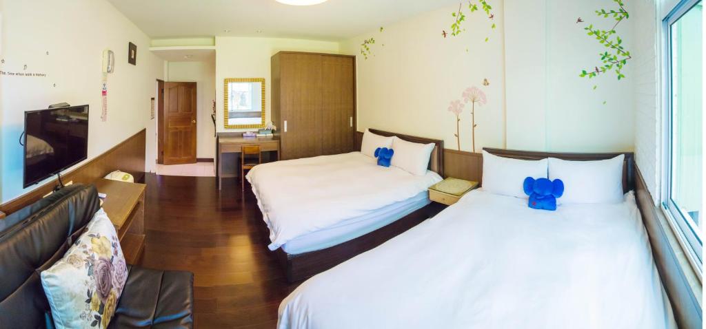 Postel nebo postele na pokoji v ubytování Siangting B&B