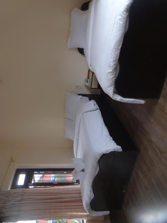 Letto o letti in una camera di Trekkers Lodge