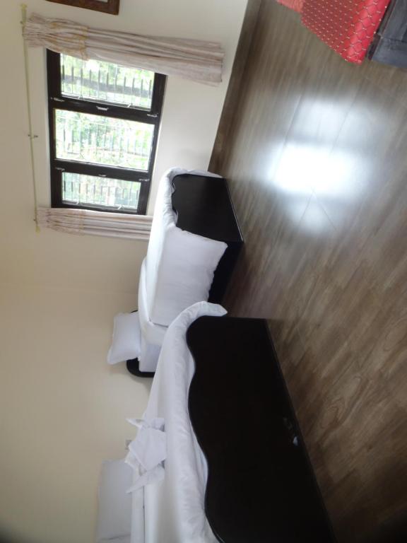 Letto o letti in una camera di Trekkers Lodge