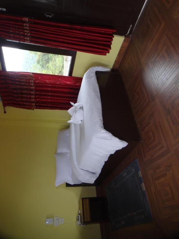 Letto o letti in una camera di Trekkers Lodge