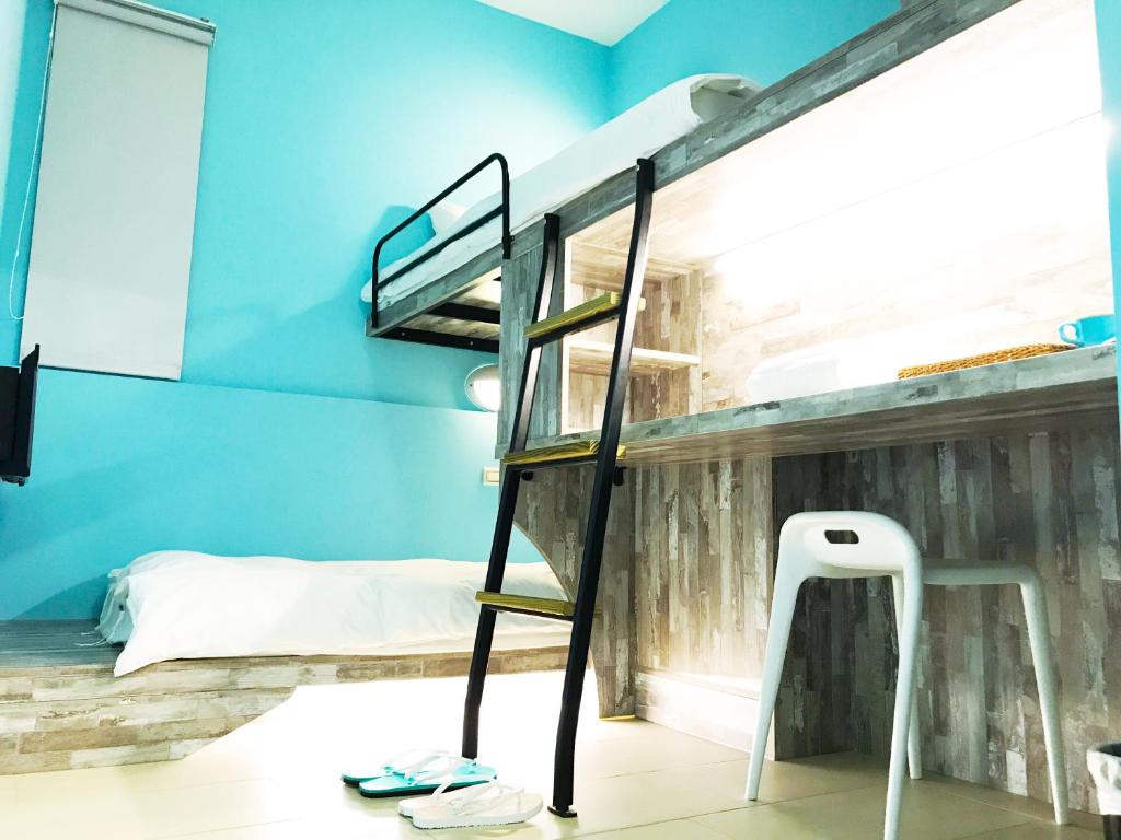 Postel nebo postele na pokoji v ubytování Divecube Hotel
