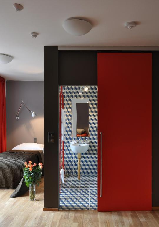 Postel nebo postele na pokoji v ubytování Hotel Kokořín