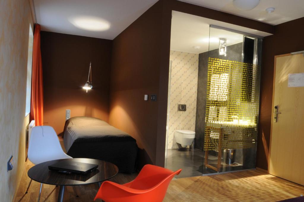 Postel nebo postele na pokoji v ubytování Hotel Kokořín