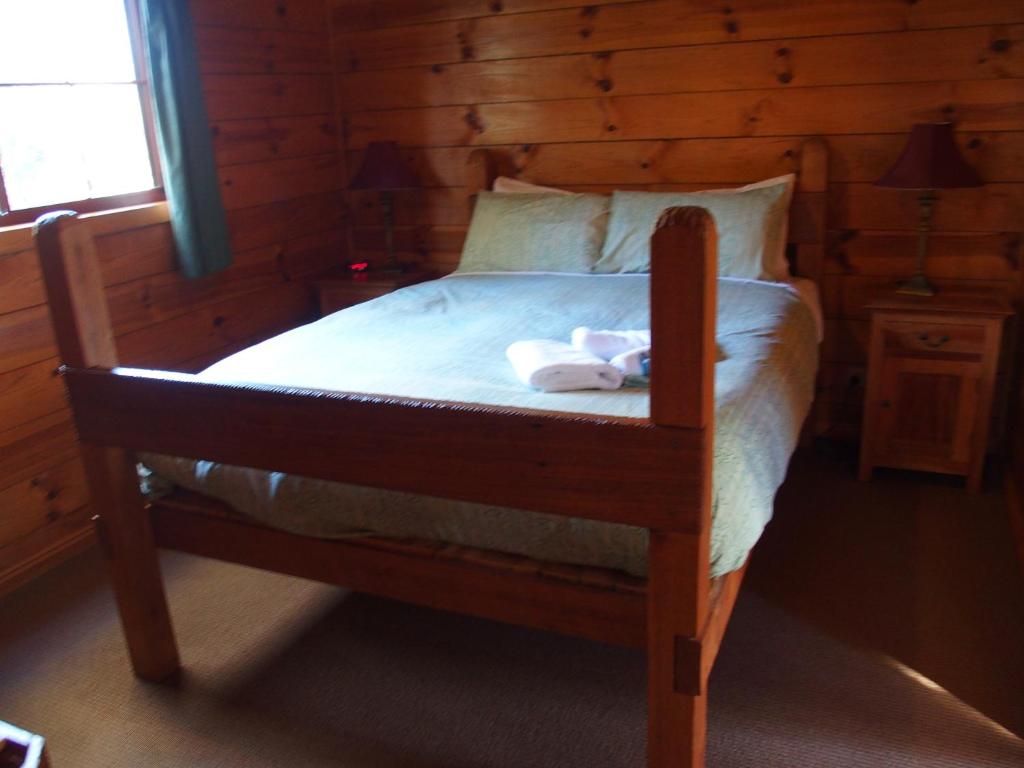 Postel nebo postele na pokoji v ubytování Cradle Highlander