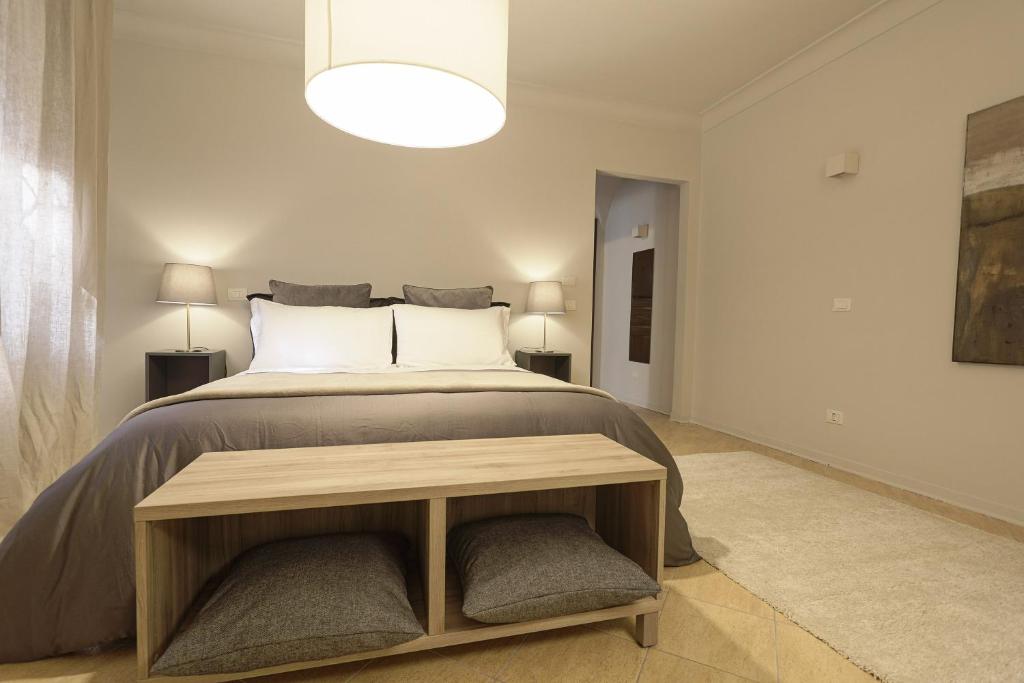 Postel nebo postele na pokoji v ubytování B&B Palazzo Bibirria