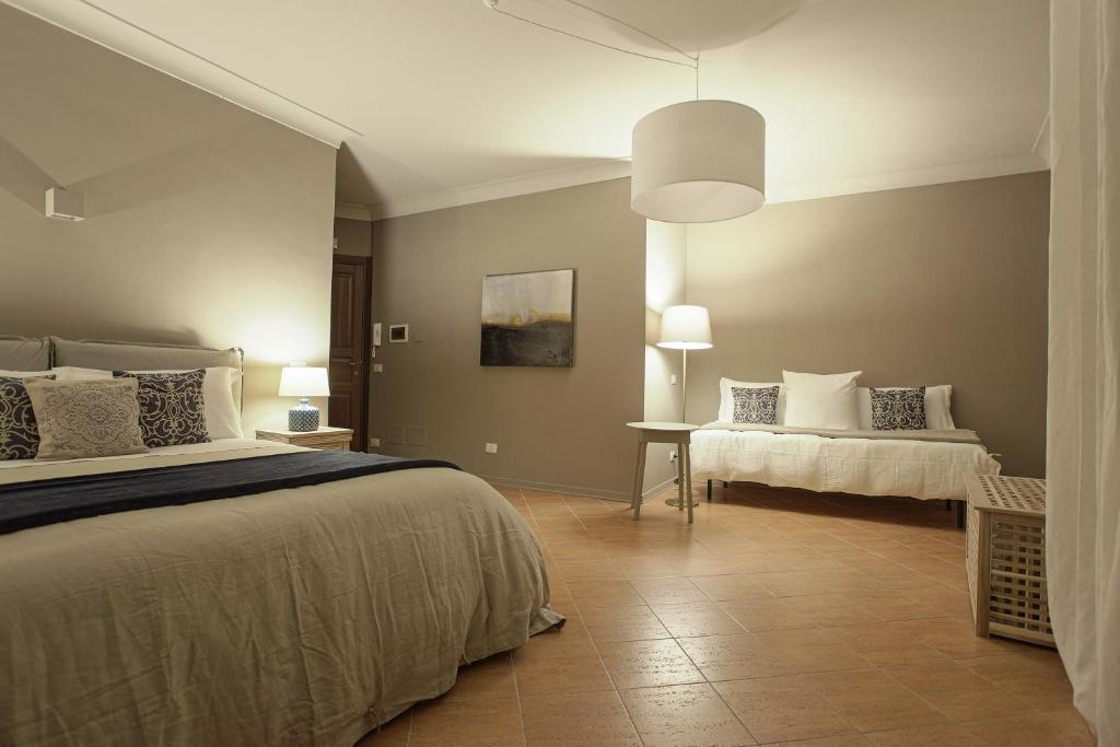 Postel nebo postele na pokoji v ubytování B&B Palazzo Bibirria