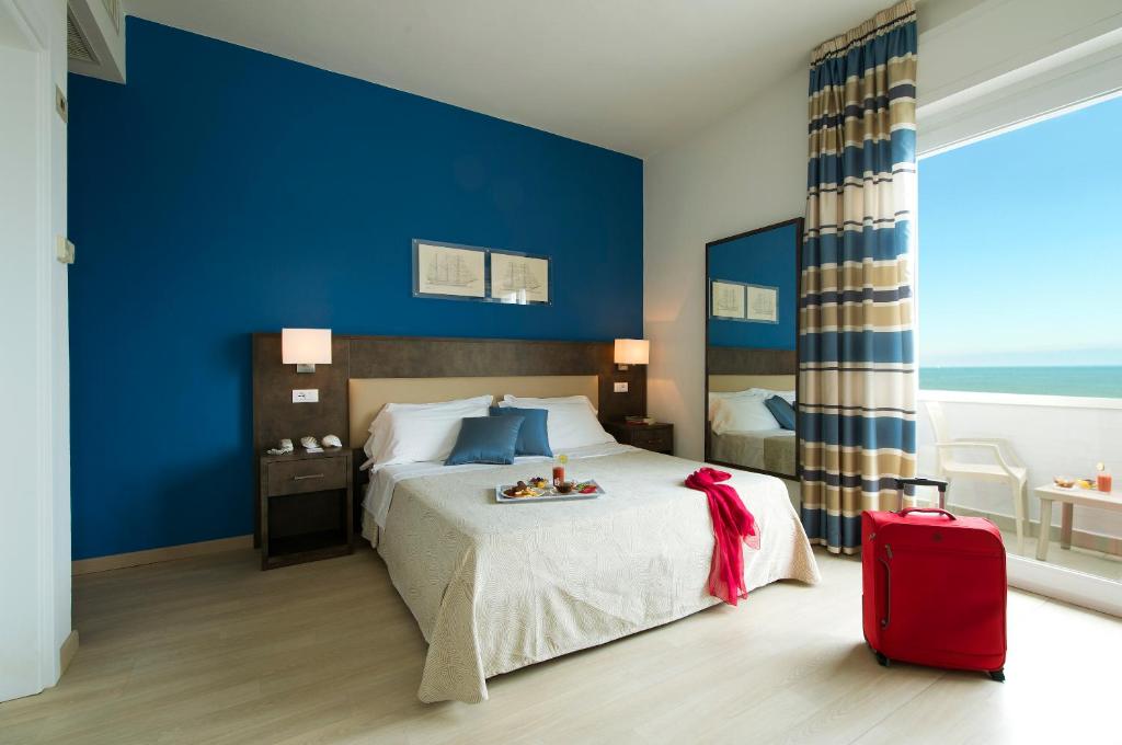 Postel nebo postele na pokoji v ubytování Hotel Giulia