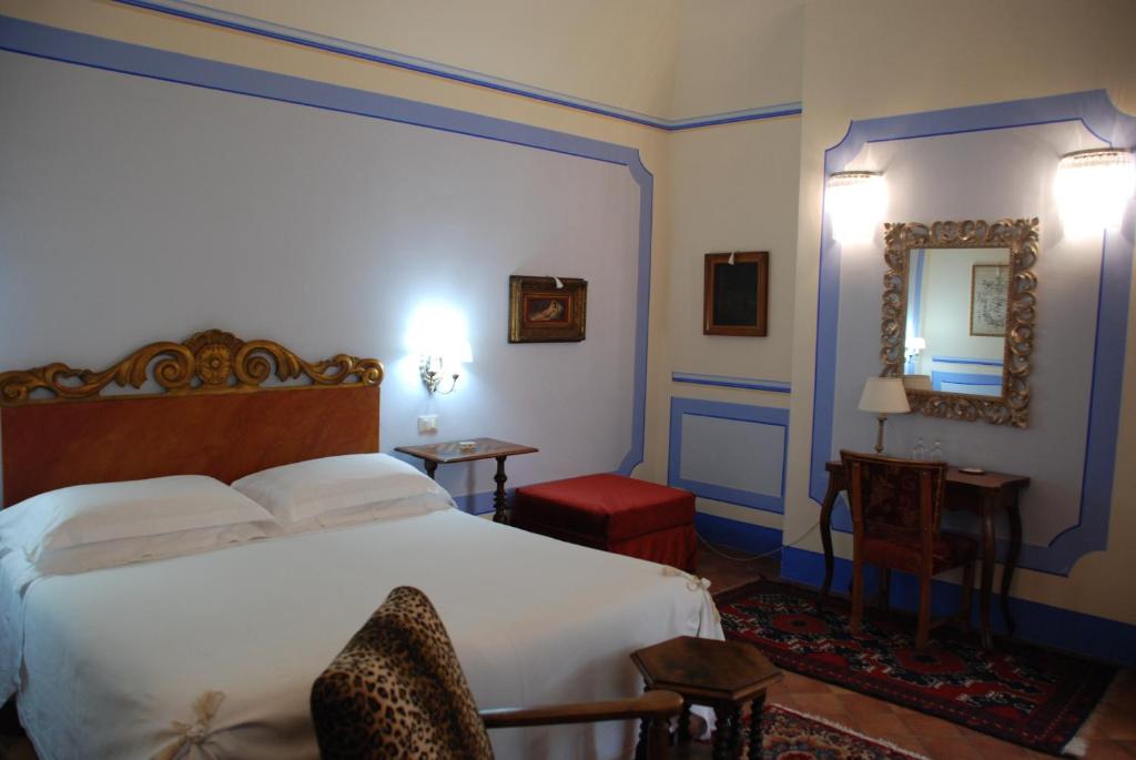 Postel nebo postele na pokoji v ubytování Il Rondò Boutique Hotel