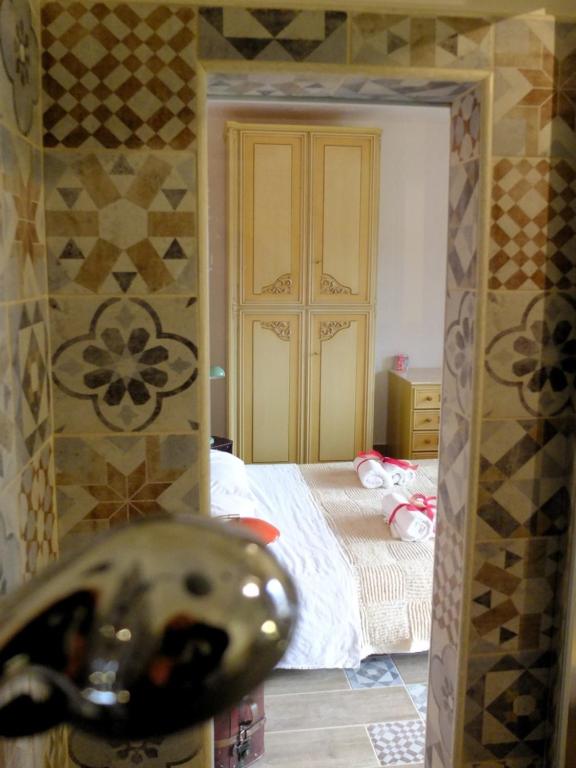 A bed or beds in a room at Incanto delle Ninfe
