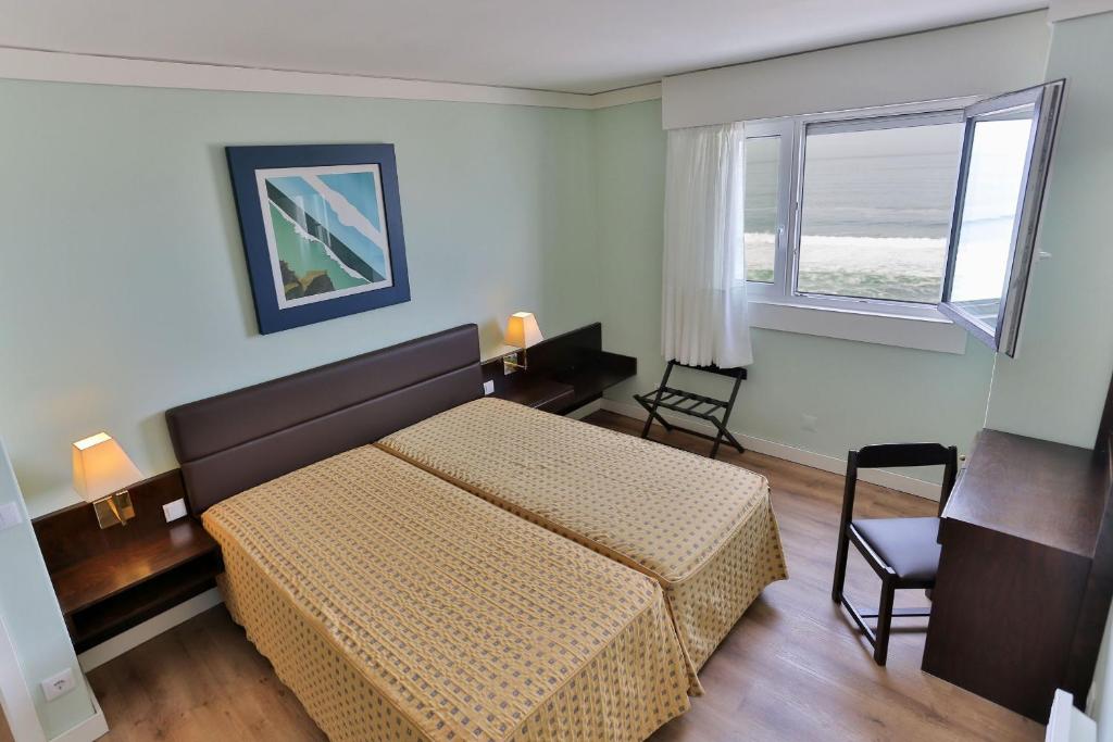 Postel nebo postele na pokoji v ubytování Hotel Apartamento Solverde