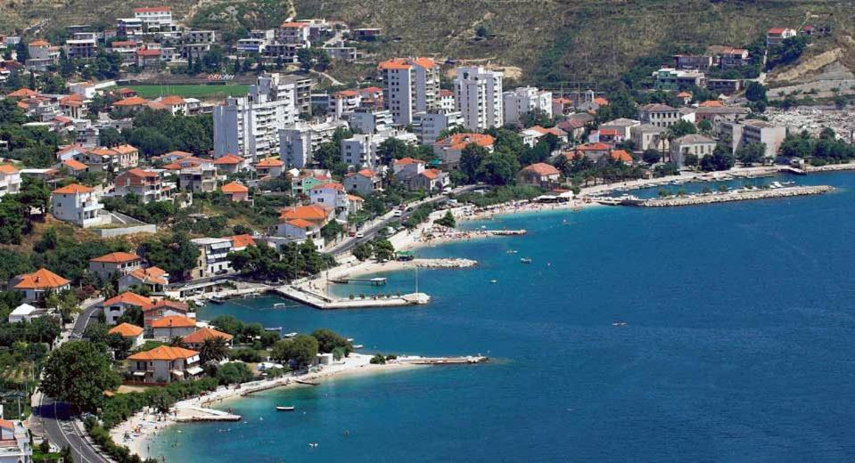 an aerial view of a city and a harbor at Apartman Sara in Dugi Rat