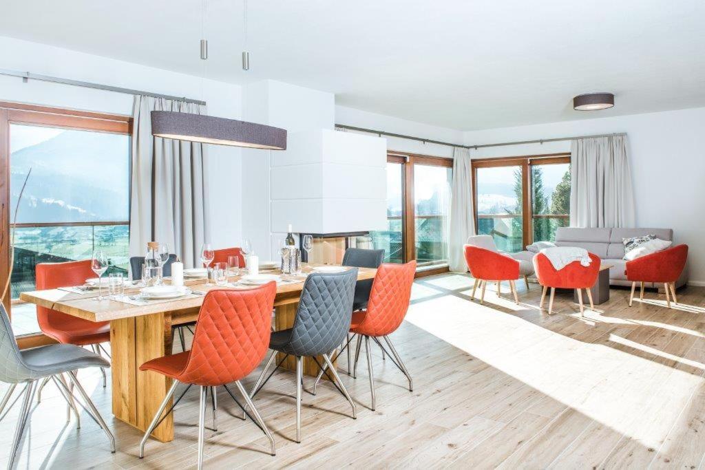 a dining room with a table and chairs at Villa Valentine in Flachau