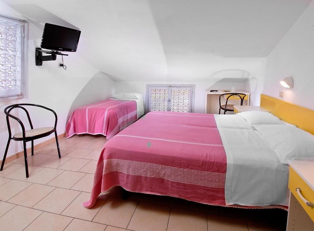 Postel nebo postele na pokoji v ubytování Hotel Levante