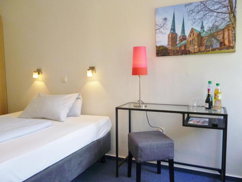 Postel nebo postele na pokoji v ubytování Hotel Am Mühlenteich