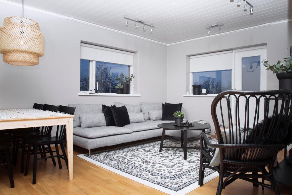 a living room with a couch and a table at Briet Apartments Akureyri in Akureyri