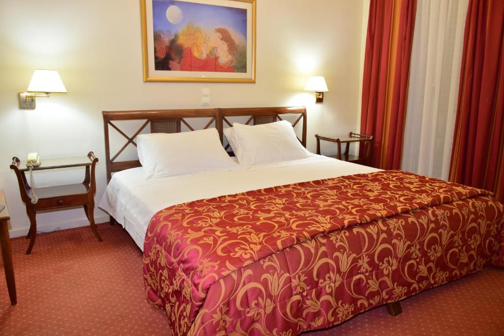 Postel nebo postele na pokoji v ubytování Hotel Galaxias