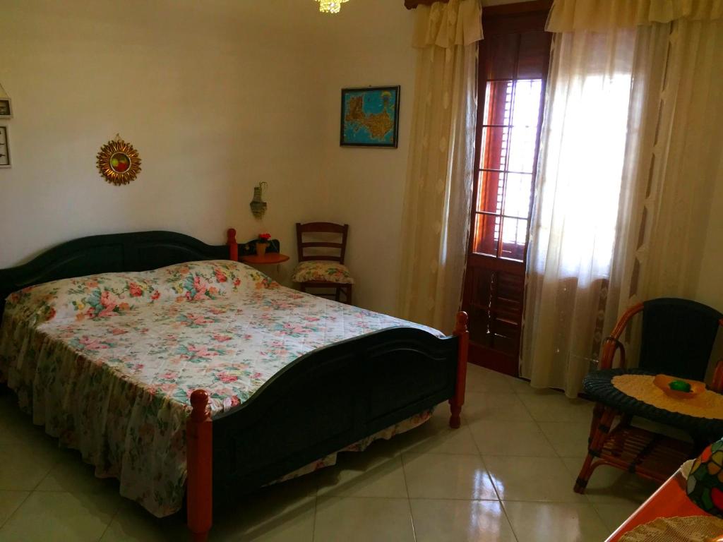 Cama o camas de una habitación en Guest House Al Giardino dei Limoni