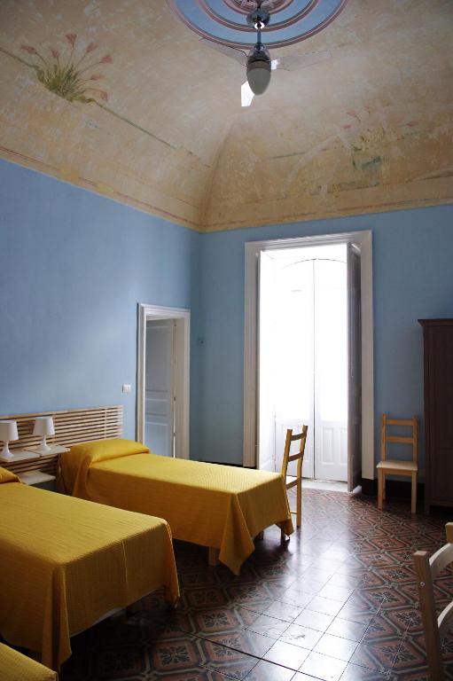 A bed or beds in a room at B&B Porta della Terra