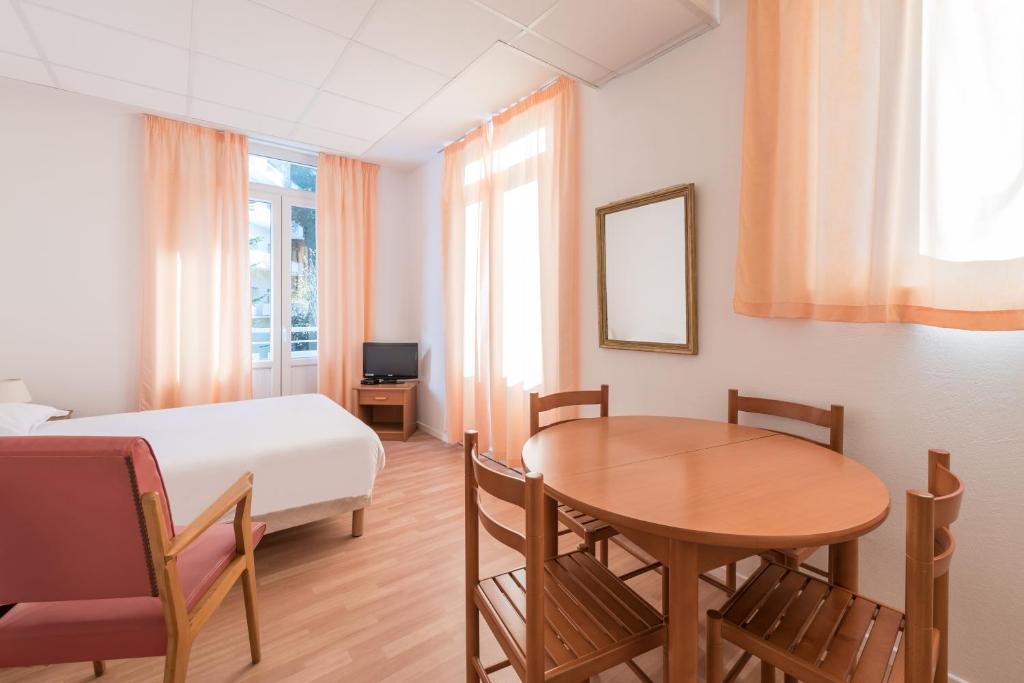 Postel nebo postele na pokoji v ubytování City Résidence Termalia