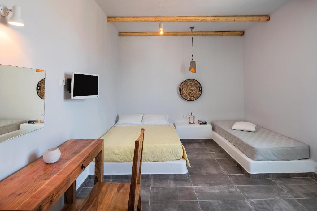 Postel nebo postele na pokoji v ubytování Nissia Beach Apartments & Suites