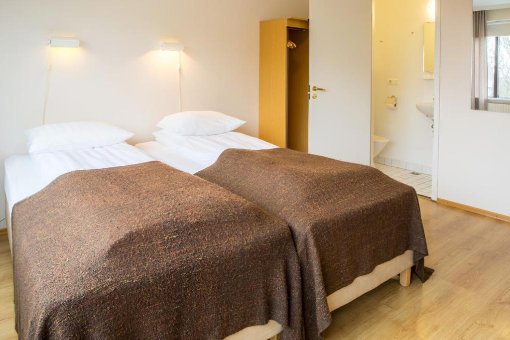 Postel nebo postele na pokoji v ubytování Guesthouse Sunna