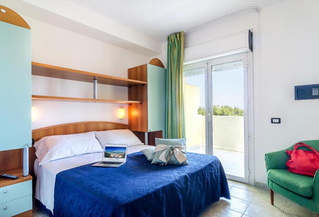 A bed or beds in a room at Residence Costa