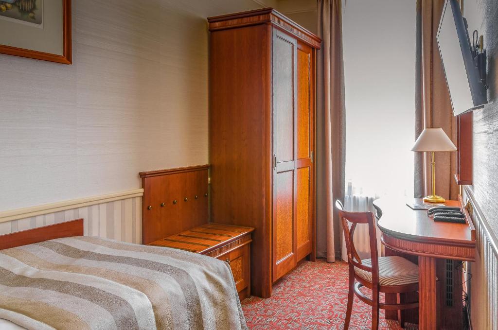 Postel nebo postele na pokoji v ubytování Adria Hotel Prague