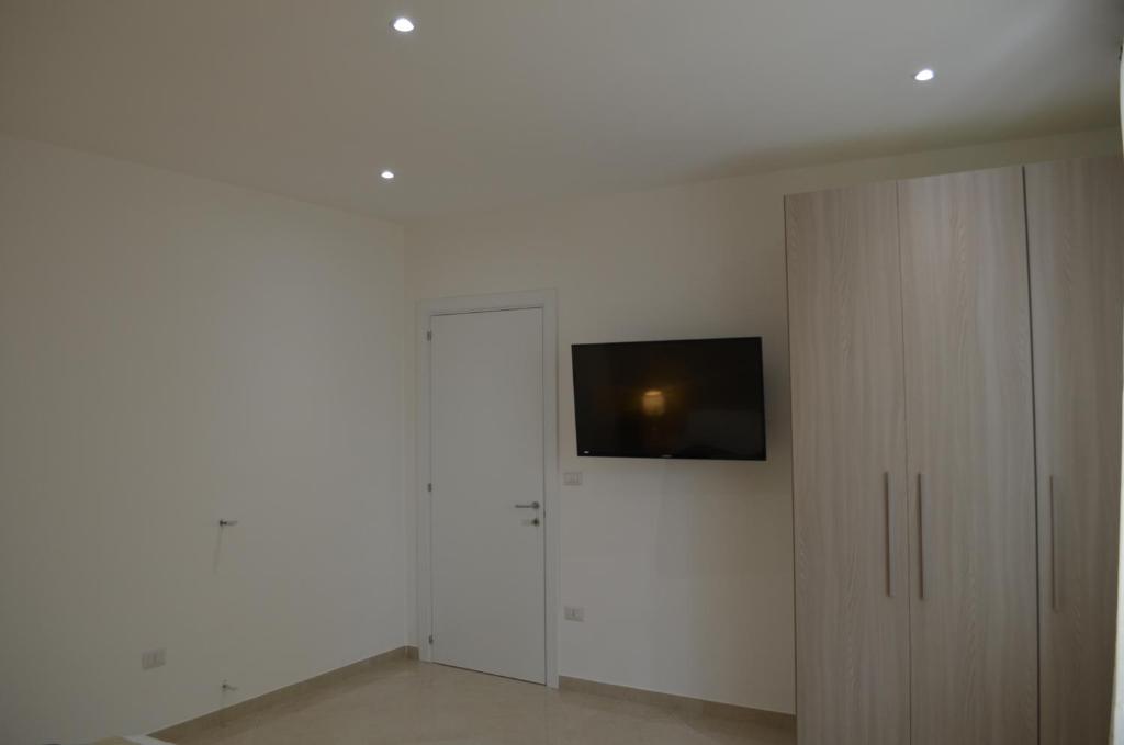 Televízia a/alebo spoločenská miestnosť v ubytovaní Casa Low Cost