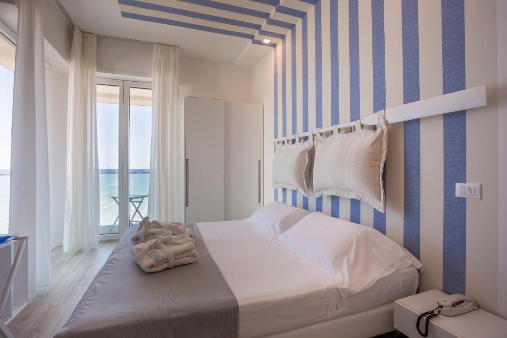 Postel nebo postele na pokoji v ubytování Hotel Nobel