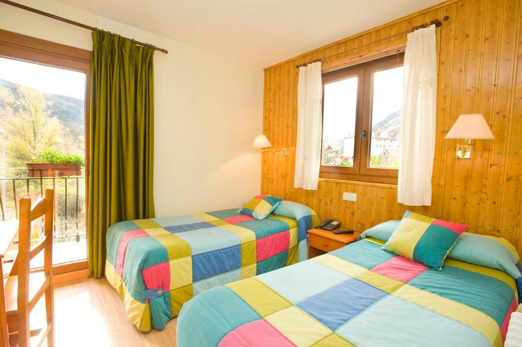 Postel nebo postele na pokoji v ubytování Hotel Llibrada