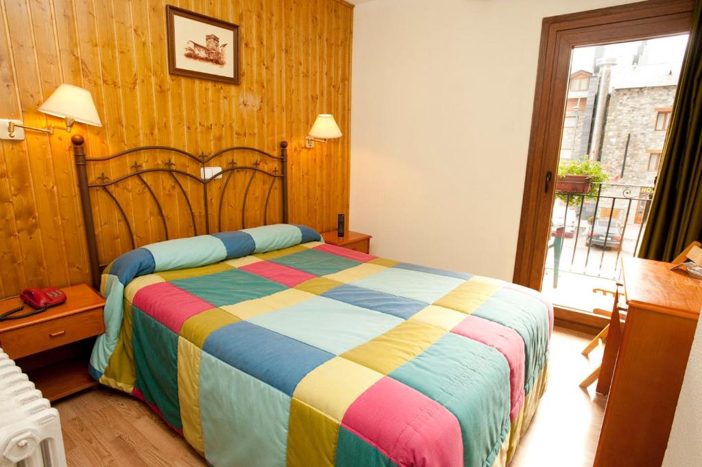 Postel nebo postele na pokoji v ubytování Hotel Llibrada