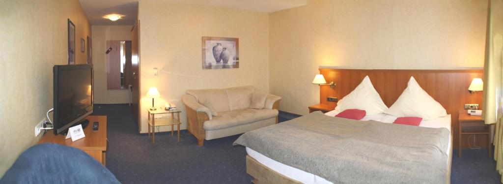 Postel nebo postele na pokoji v ubytování Hotel Vier Linden