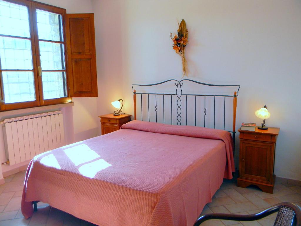 Łóżko lub łóżka w pokoju w obiekcie Agriturismo Avanella Appartamenti a 150 mt dalla piscina 150 mt from swimming pool