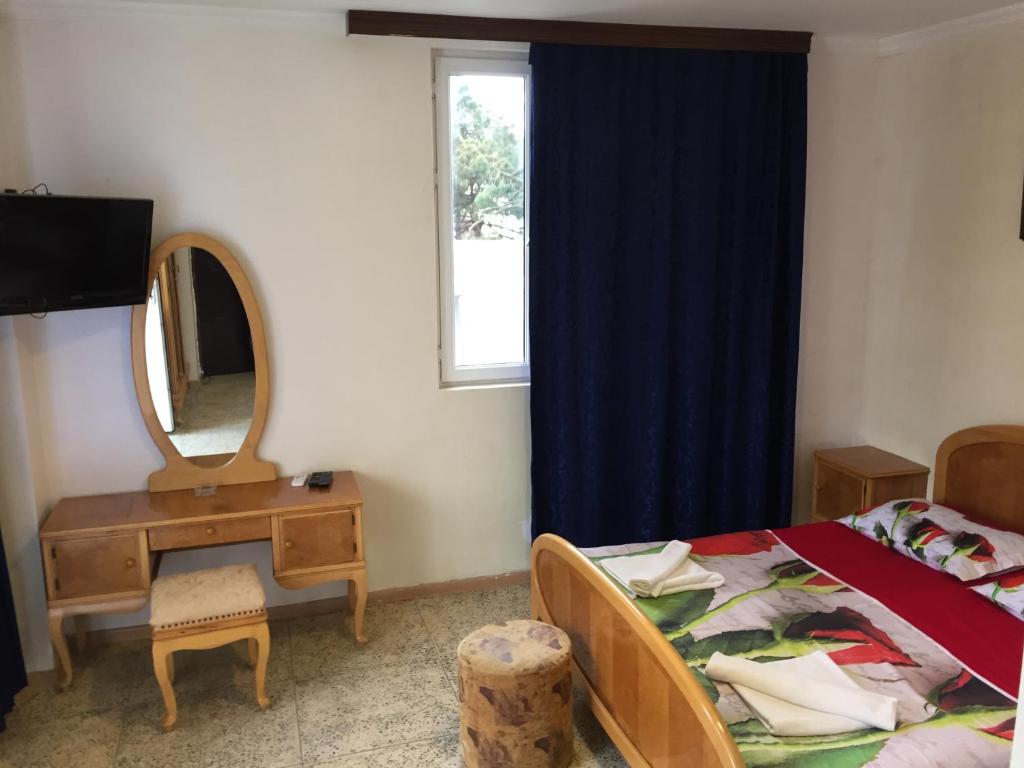 Postel nebo postele na pokoji v ubytování Hotel George